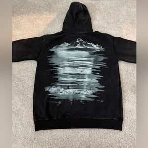 Brand new black hoodie with penguin and mountains.

Size Large